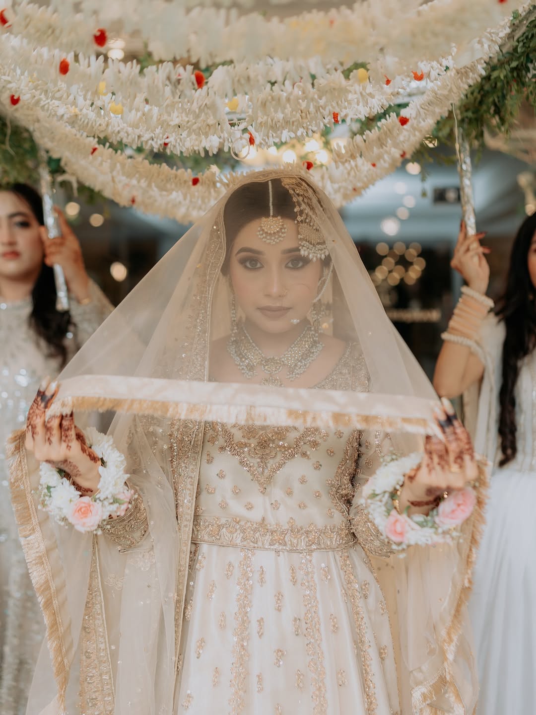 Ivory Nikkah bridal veil with sheer fabric, delicate embellishments and elegant border for a Pakistani Muslim wedding.