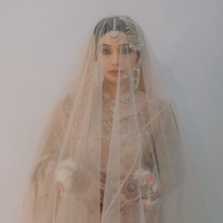 Ivory Nikkah bridal veil with sheer fabric, delicate embellishments and elegant border for a Pakistani Muslim wedding.