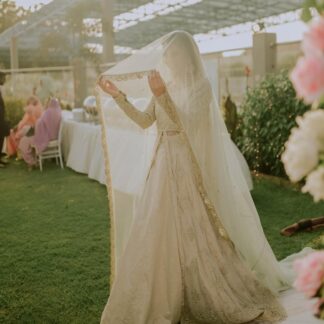 Ivory Nikkah bridal veil with a long sheer design and elegant gold embroidered border for a Pakistani Muslim wedding.