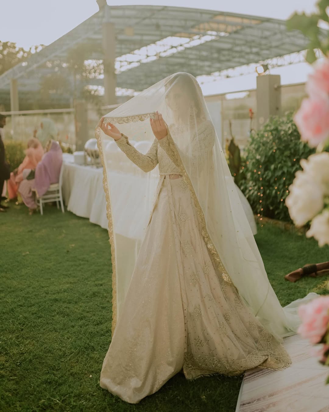 Ivory Nikkah bridal veil with a long sheer design and elegant gold embroidered border for a Pakistani Muslim wedding.