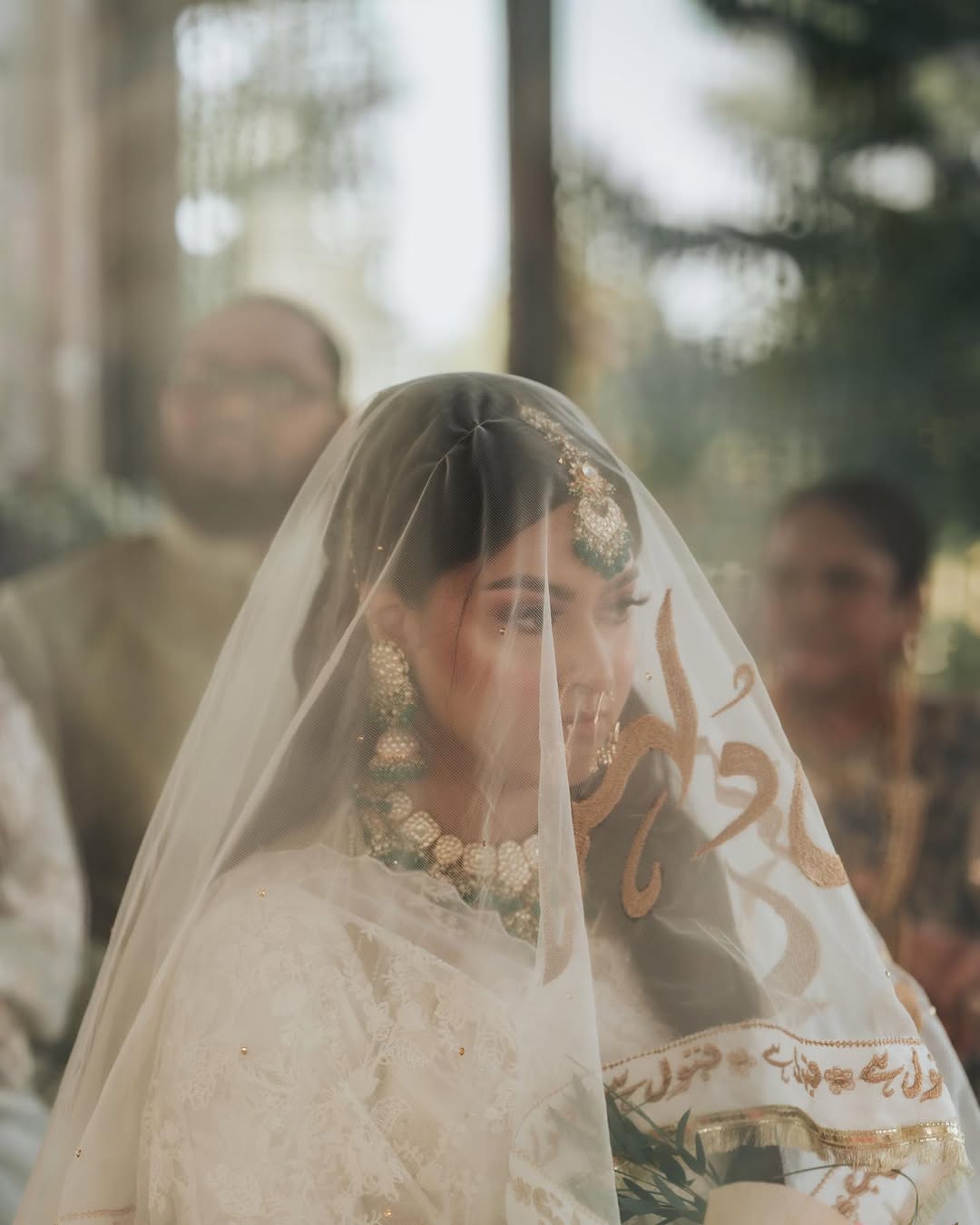 Personalized ivory Nikkah dupatta with custom gold name embroidery and Urdu calligraphy for a Pakistani Muslim bride.