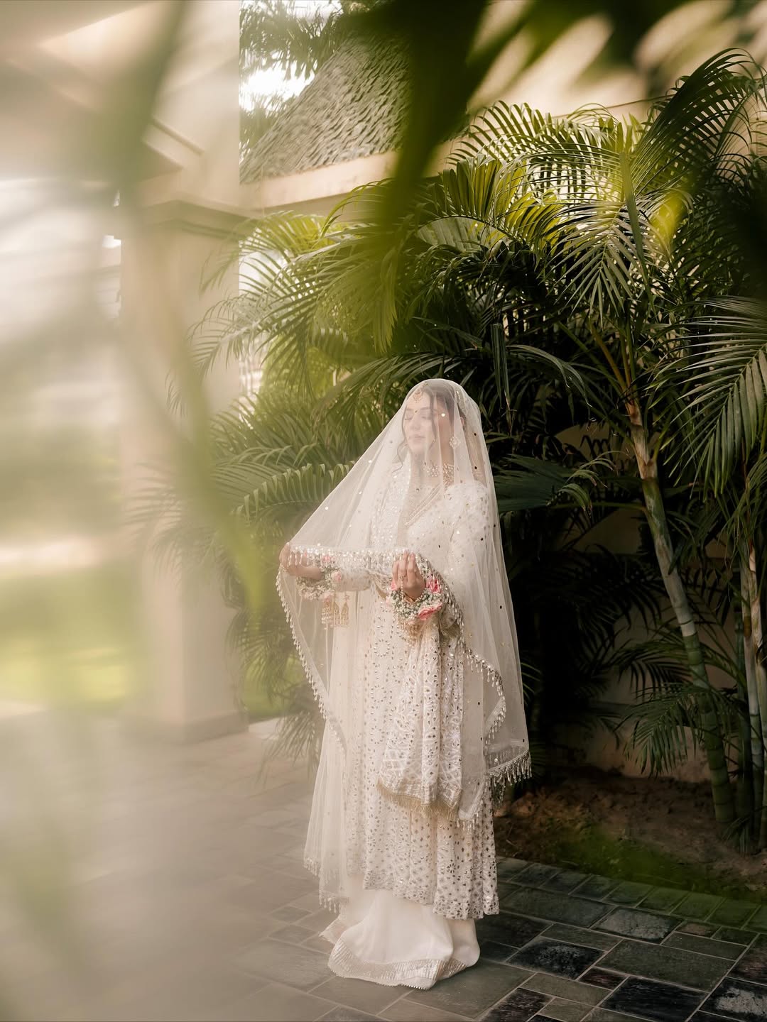 White Nikkah bridal veil with sheer fabric, delicate sequin embellishments and decorative border for a Pakistani Muslim bride.