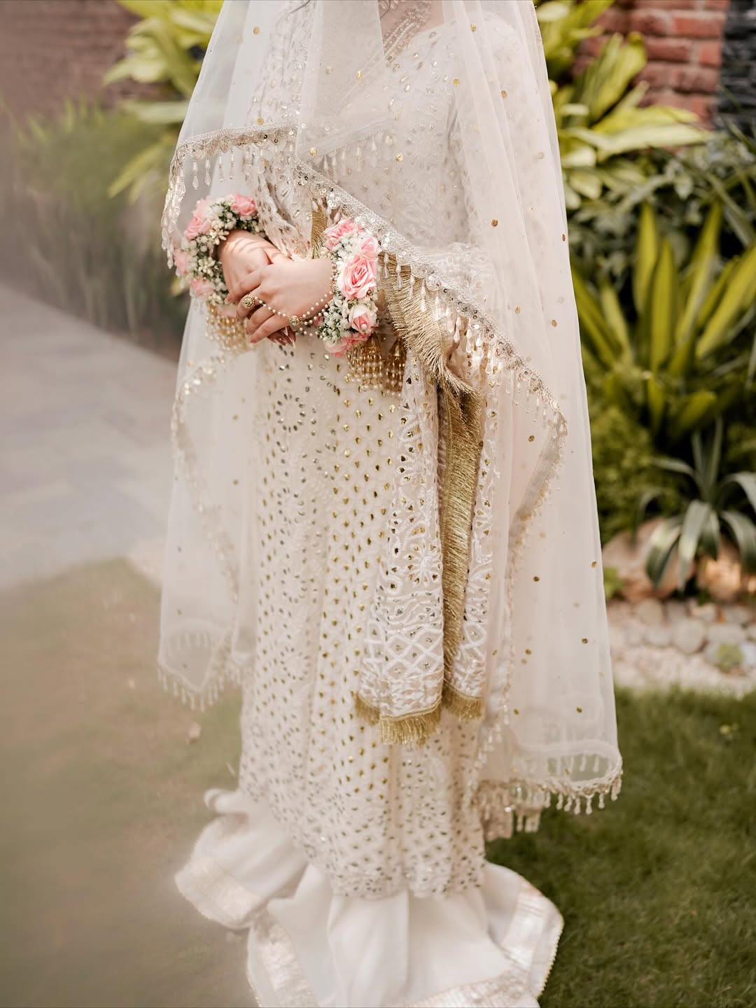 White Nikkah bridal veil with sheer fabric, delicate sequin embellishments and decorative border for a Pakistani Muslim bride.
