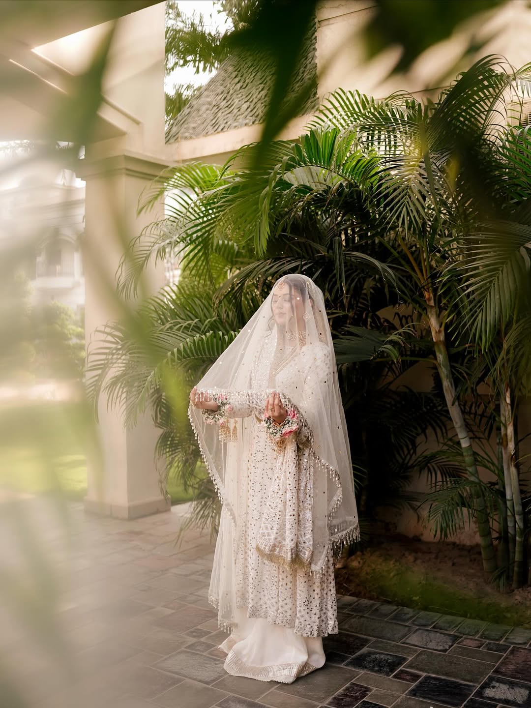 White Nikkah bridal veil with sheer fabric, delicate sequin embellishments and decorative border for a Pakistani Muslim bride.