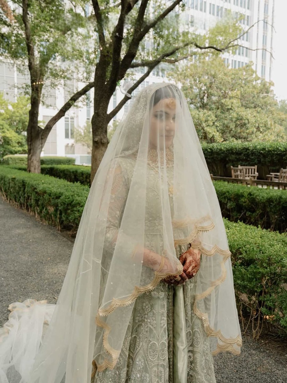 Long White Nikkah Veil with sheer fabric, delicate embellishments and an extra-long flowing train for a Pakistani Muslim bride.