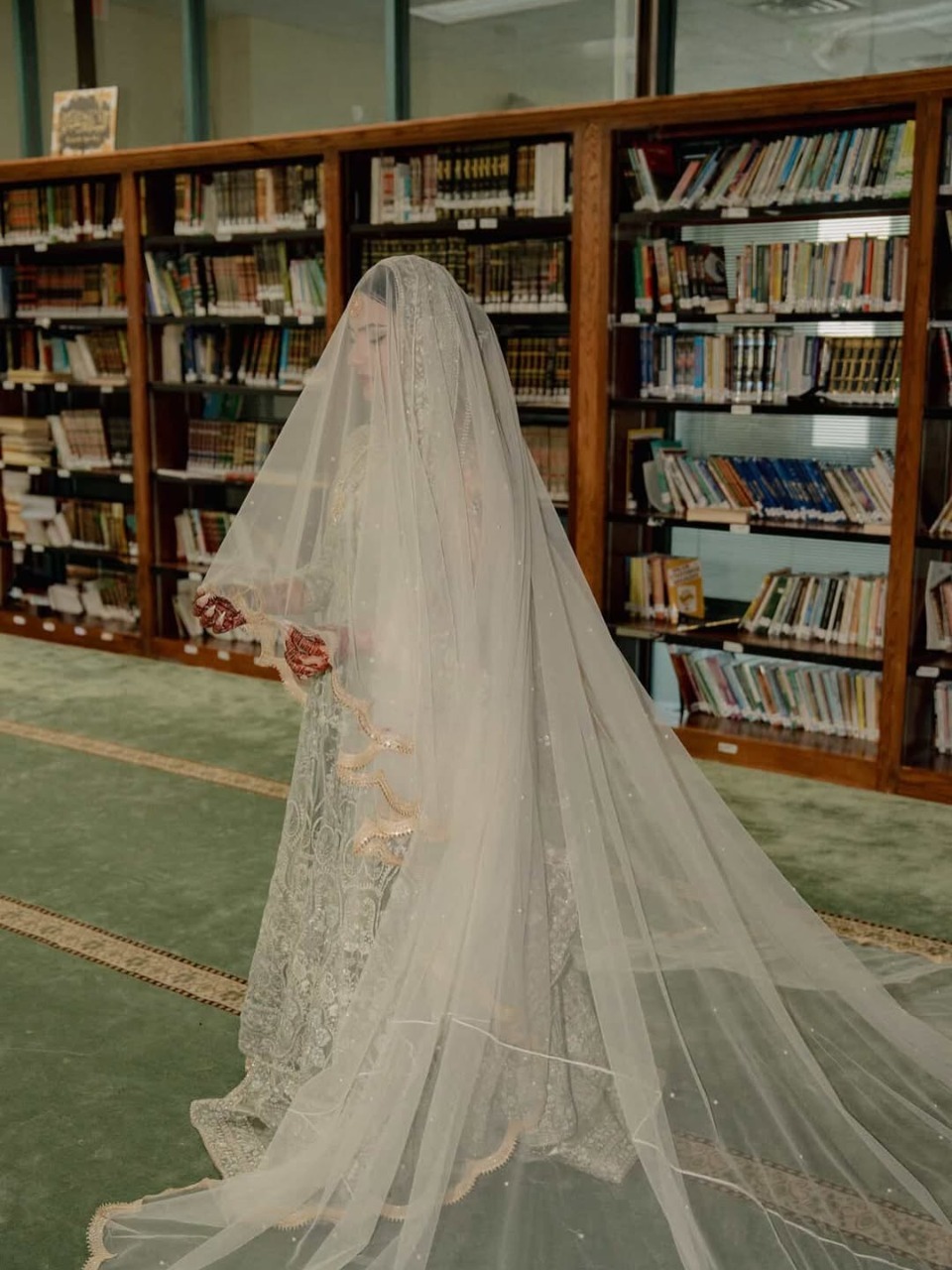 Long White Nikkah Veil with sheer fabric, delicate embellishments and an extra-long flowing train for a Pakistani Muslim bride.