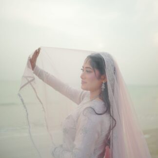 Blush Pink Nikkah Bridal Veil with sheer fabric and elegant embellished border worn by a Muslim bride for a Pakistani wedding ceremony.