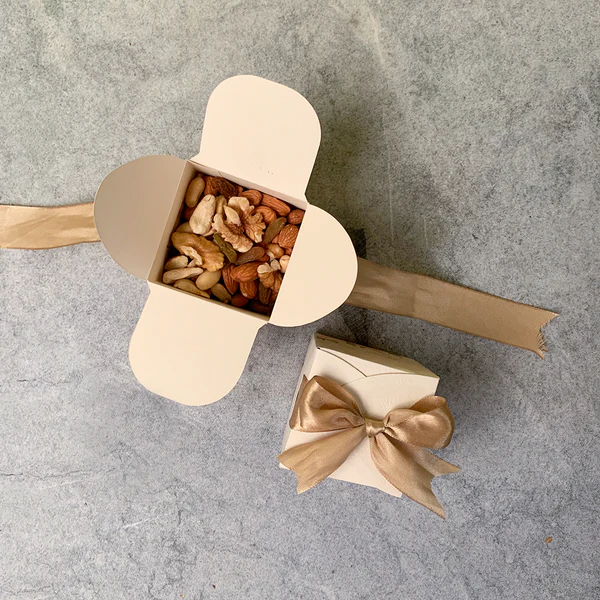 Floral cube wedding favor boxes with Thank You design and satin ribbon for Pakistani, Nikkah and Muslim wedding celebrations.