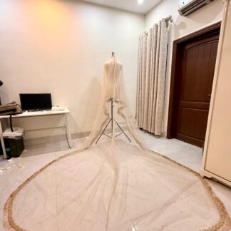 Ivory Long Nikkah Dupatta USA with extra-long sheer bridal train, delicate sparkle embellishments and elegant gold fringe border.