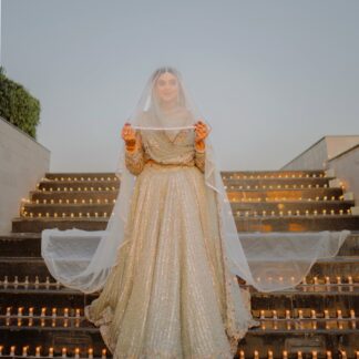 Ivory Nikkah Bridal Veil with sheer flowing fabric and delicate embellished border styled over a traditional Pakistani bridal outfit.