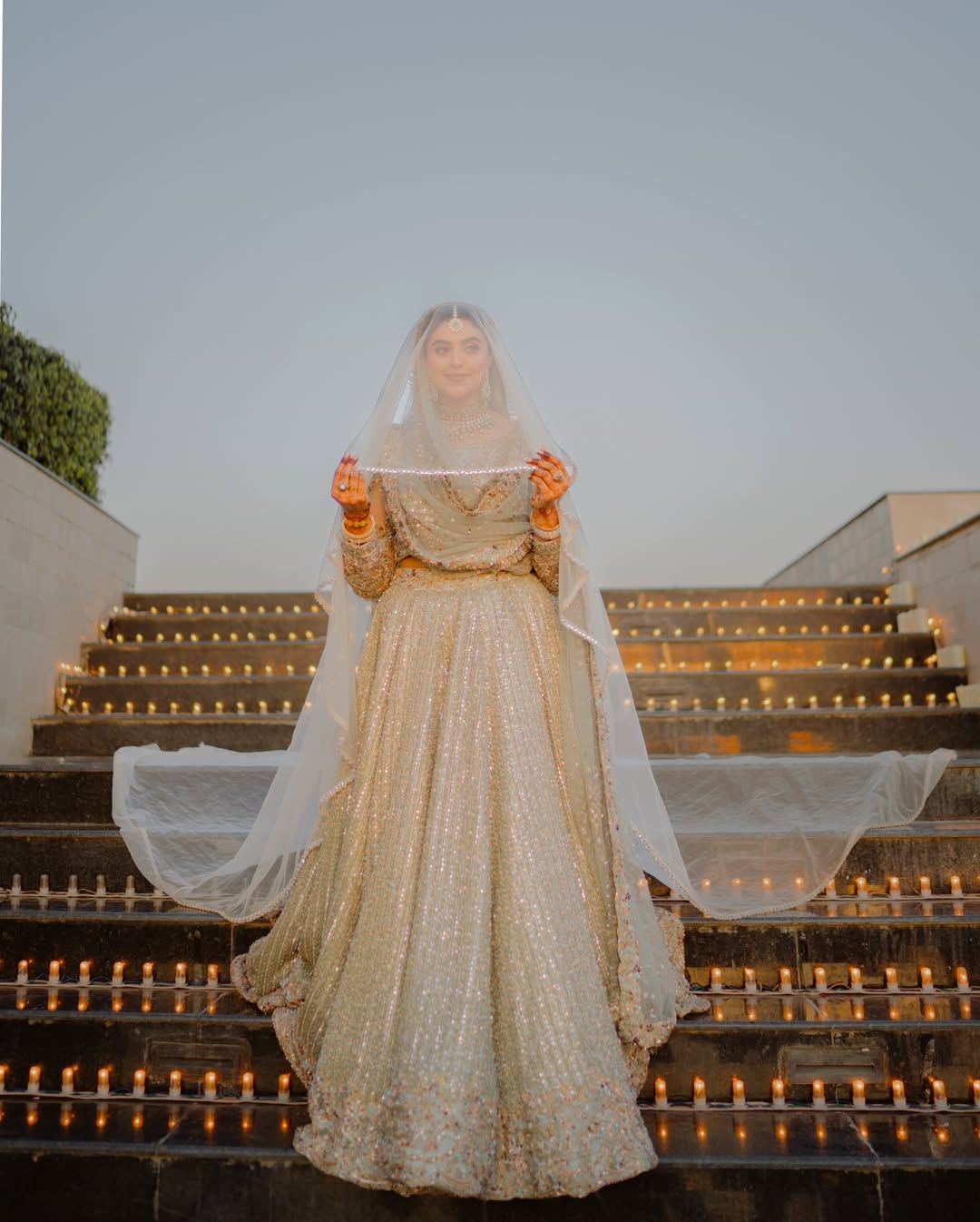 Ivory Nikkah Bridal Veil with sheer flowing fabric and delicate embellished border styled over a traditional Pakistani bridal outfit.