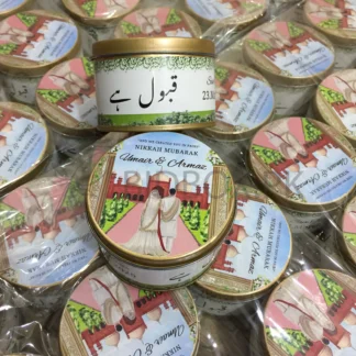 Nikkah Mubarak Tin Favor Boxes USA with personalized couple artwork, custom wedding details and round gold-tone design for Pakistani weddings.