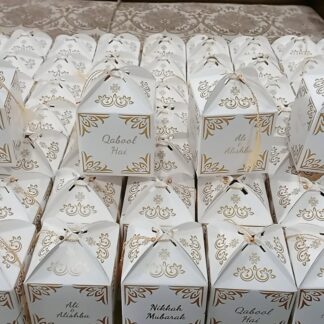 Personalized white and gold Qabool Hai favor boxes with ornate detailing for Nikkah ceremonies, Muslim weddings and Pakistani wedding celebrations.
