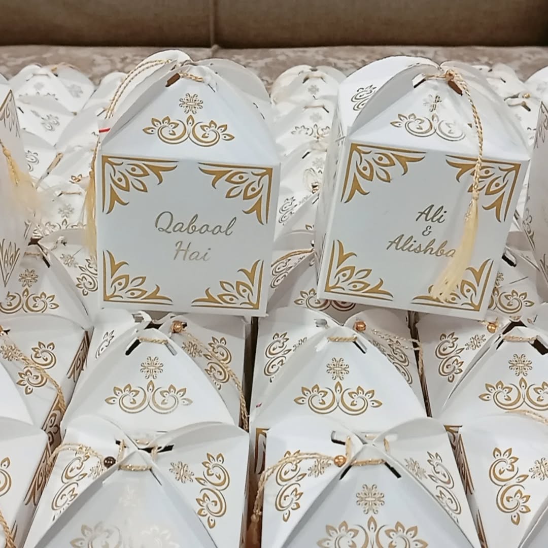 Personalized white and gold Qabool Hai favor boxes with ornate detailing for Nikkah ceremonies, Muslim weddings and Pakistani wedding celebrations.