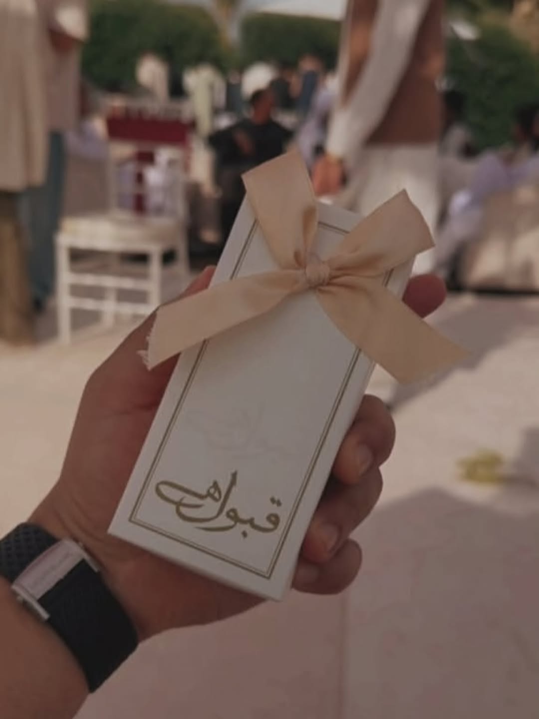 Qabool Hai Nikkah favor box in ivory white with elegant border design and soft ribbon bow for Muslim wedding celebrations.