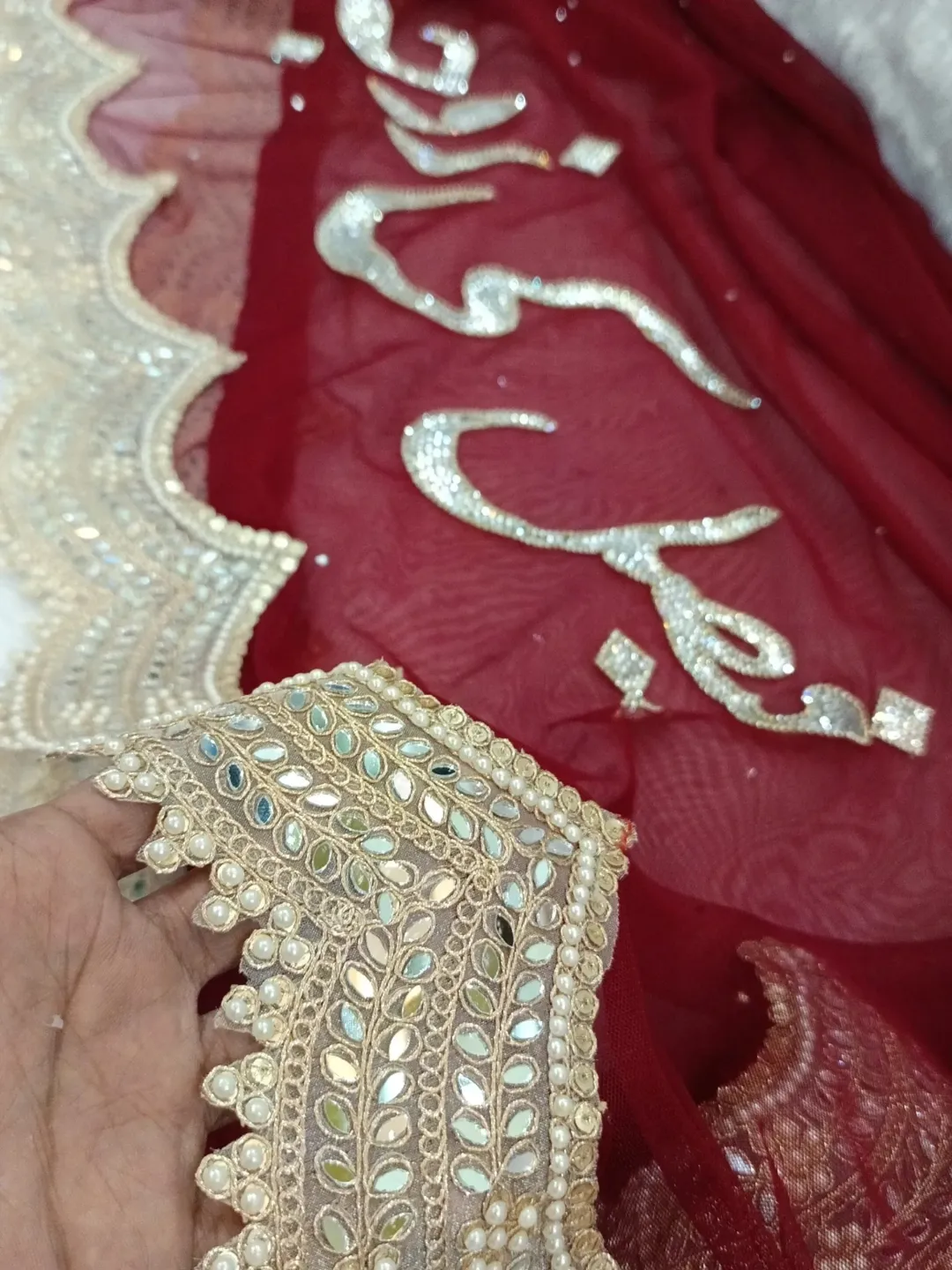 Red Nikkah Dupatta USA with statement calligraphy, mirror-style work, pearl detailing and embellished border for Pakistani brides.