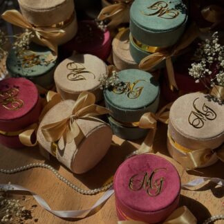 Emerald Green Nikkah Favor Boxes USA with velvet finish, personalized gold initials, gold detailing and satin bows for Pakistani weddings.