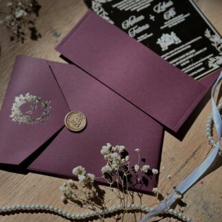 Burgundy Nikkah invitation cards with gold detailing and wax seal for personalized Pakistani and Muslim weddings in the USA.