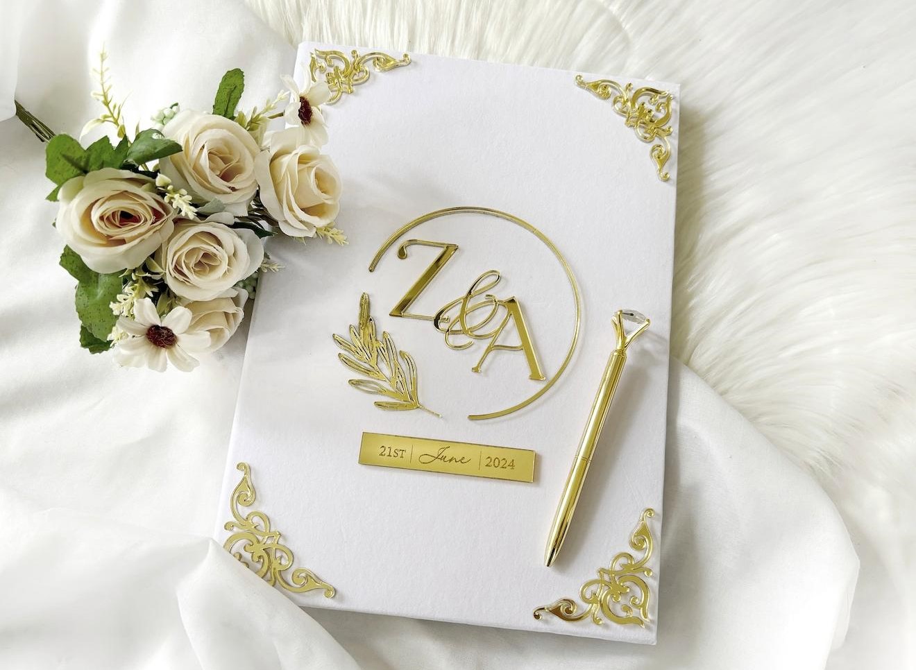 Luxury ivory white personalized Nikkah Nama folder with gold couple's initials monogram, decorative botanical wreath, and elegant velvet-style cover for Pakistani Muslim weddings.